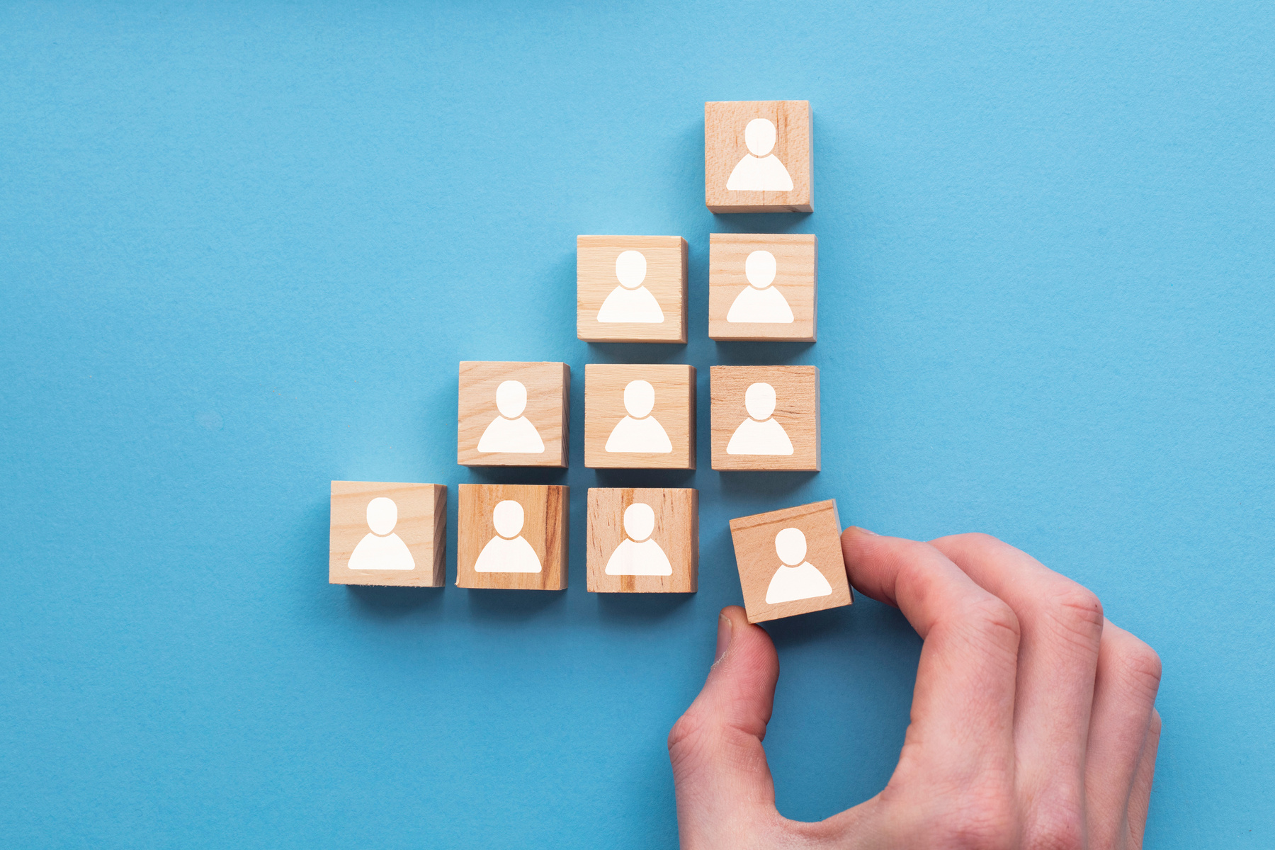 Hand Adding Wooden Block to the Set 